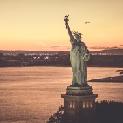 fly with Flynyon over New York City State of Liberty at the sunset