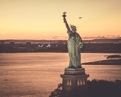 fly with Flynyon over New York City State of Liberty at the sunset